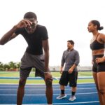 일상의 작은 움직임, 건강을 지키는 ‘마이크로 운동’ 트렌드 확산 Athletes resting on a track after training.