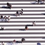 일상 속 걷기 습관, 건강을 지키는 작은 변화 aerial view photography of group of people walking on gray and white pedestrian lane