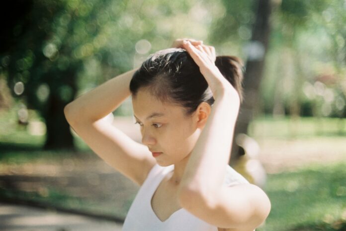Photo by Đặng Ngọc Kha woman in white tank top